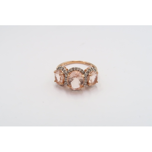 24 - A 9ct gold morganite and diamond triple cluster ring. Size  M 1/2. Weight 3.07 grams