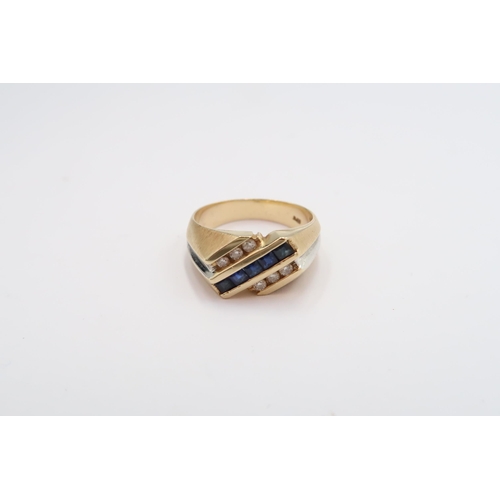 14 - A sapphire and diamond three row dress ring. Stamped 14K. Size S 1/2. Weight 8.47 grams