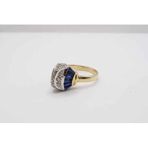 2 - An 18ct Gold Sapphire & Diamond ring, head individually set with tapered baguette sapphires with rou... 