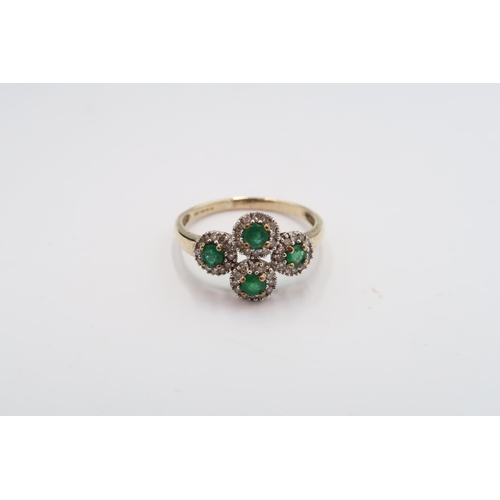 21 - A 9ct gold emerald and diamond quatrefoil cluster ring. Size R. Weight 2.17 grams