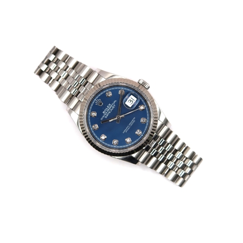 A 2020 Rolex Oyster Datejust, 36mm Steel & White Gold. Reference 126234 Featuring a Blue Factory Diamond Dial. Box & Papers. 

Condition: Case and Bracelet in good order, Clasp shows signs of obvious wear. Winds smoothly with date changing over correctly, keeping time during period of observation.