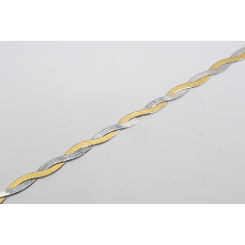 9 - A 9ct Gold Bracelet of a Plait Herringbone Design.

Weight: 2.43g Length: 19cm