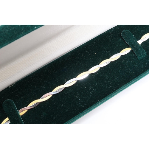 9 - A 9ct Gold Bracelet of a Plait Herringbone Design.

Weight: 2.43g Length: 19cm