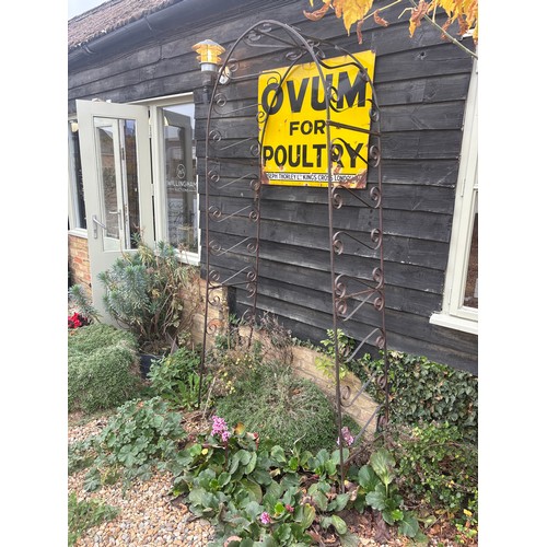 623 - A wrought iron garden arch - Height 240cm x Width 80cm
