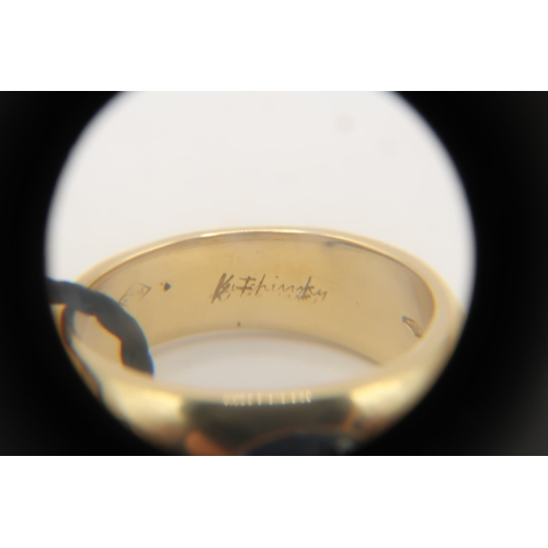 2 - An 18ct 'Kutchinsky' Cabochon Sapphire and Diamond ring. Condition: Head and shank in good order, In... 