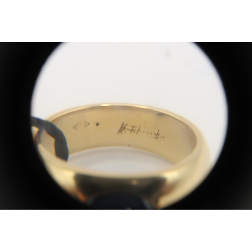 2 - An 18ct 'Kutchinsky' Cabochon Sapphire and Diamond ring. Condition: Head and shank in good order, In... 