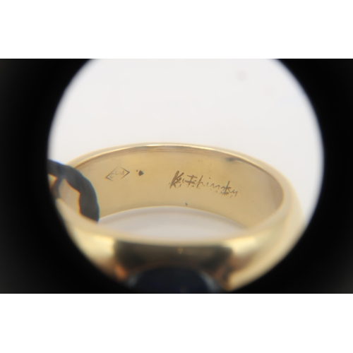 2 - An 18ct 'Kutchinsky' Cabochon Sapphire and Diamond ring. Condition: Head and shank in good order, In... 