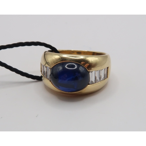 2 - An 18ct 'Kutchinsky' Cabochon Sapphire and Diamond ring. Condition: Head and shank in good order, In... 