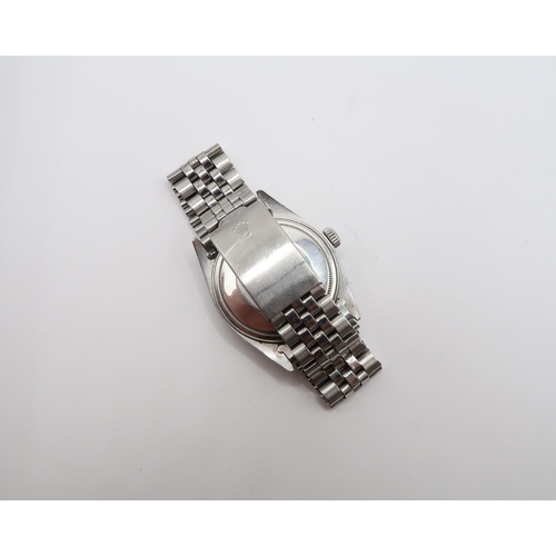 251 - A 1975, Rolex Oyster Perpetual Date Just, Reference 1604, 36mm. Featuring a stainless steel jubilee ... 