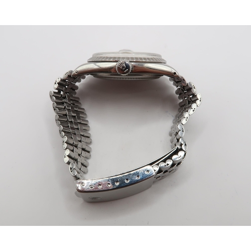 251 - A 1975, Rolex Oyster Perpetual Date Just, Reference 1604, 36mm. Featuring a stainless steel jubilee ... 
