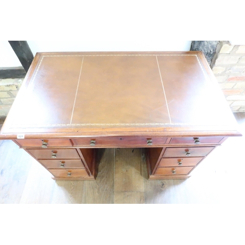 624 - A good quality 19th century freestanding desk with a leather inset top over nine drawers - in good c... 