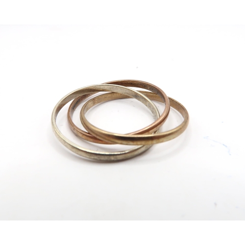 74 - A 9ct three colour 'Russian' wedding band. Weight: 3.14g
