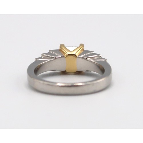 4 - An 18ct gold and platinum ring designed as a fancy light yellow princess cut diamond with three grad... 