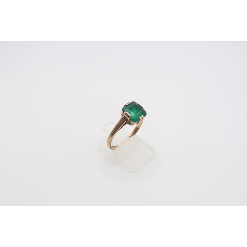 47 - A green stone ring. Size R. Stamped 9ct. Weight 2.78 grams