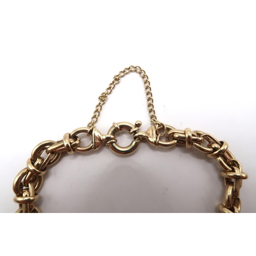 5 - A 9ct yellow gold bracelet with safety chain - approx weight 34.8grams