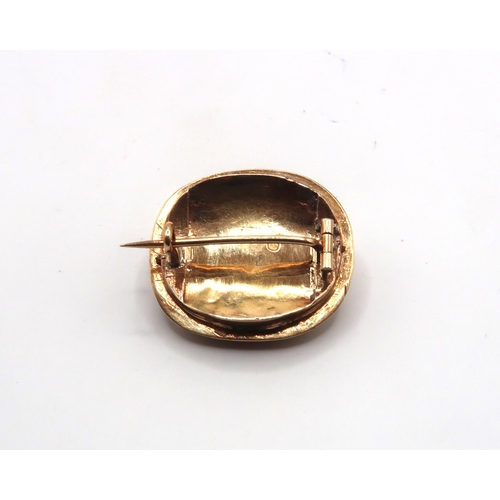 11 - An Edwardian Style 14ct Gold and Chalcedony Brooch featuring fine filigree wire work surrounding sto... 