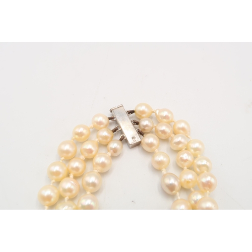 20 - A 18ct & Diamond Three Strand Cultured Pearl Necklace, Clasp is of a bar form with Five Claw Set... 