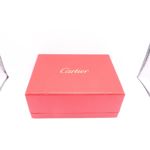 21 - A Pair of Cartier Santos Steel & 18ct Gold Cufflinks. Numbered BM5929, With original box and cer... 