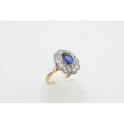 28 - A Fine Quality Platinum and 18ct Yellow Gold Oval Sapphire and Diamond Ring, Sapphire is a Very Good... 