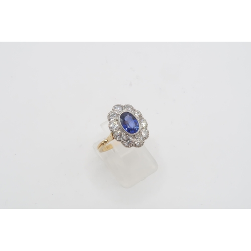 28 - A Fine Quality Platinum and 18ct Yellow Gold Oval Sapphire and Diamond Ring, Sapphire is a Very Good... 
