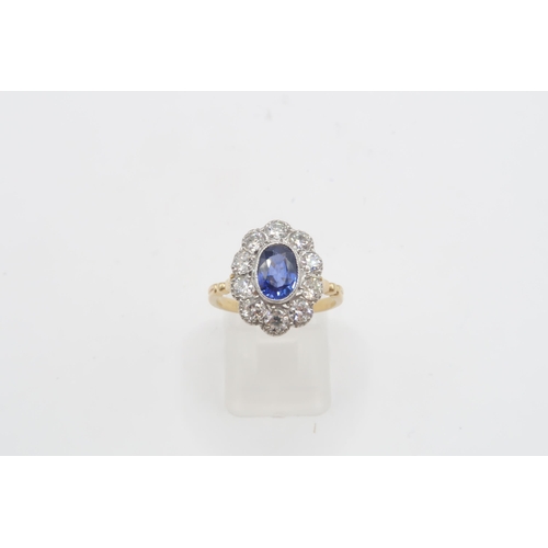 28 - A Fine Quality Platinum and 18ct Yellow Gold Oval Sapphire and Diamond Ring, Sapphire is a Very Good... 