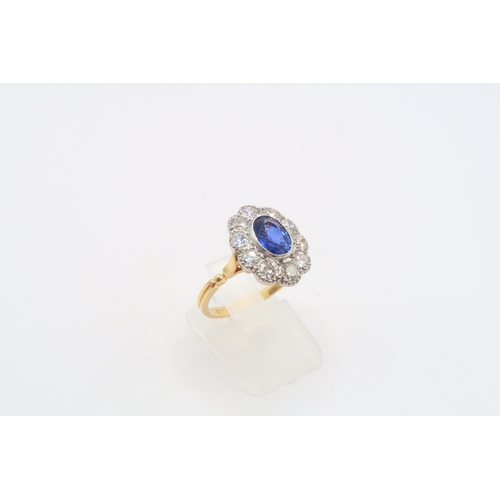 28 - A Fine Quality Platinum and 18ct Yellow Gold Oval Sapphire and Diamond Ring, Sapphire is a Very Good... 