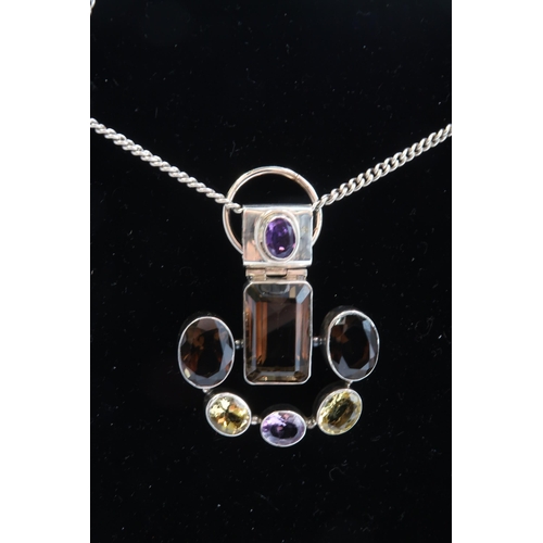 29 - An Unusual Silver Amethyst, Citrine and Smoky Quartz Designer Pendant and Chain, Chain approx. 50cms... 