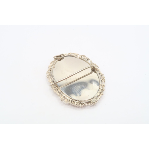 37 - A Vintage Continental Silver (800), Oval Pendant Brooch with a Hand painted Miniature Of a Young Lad... 