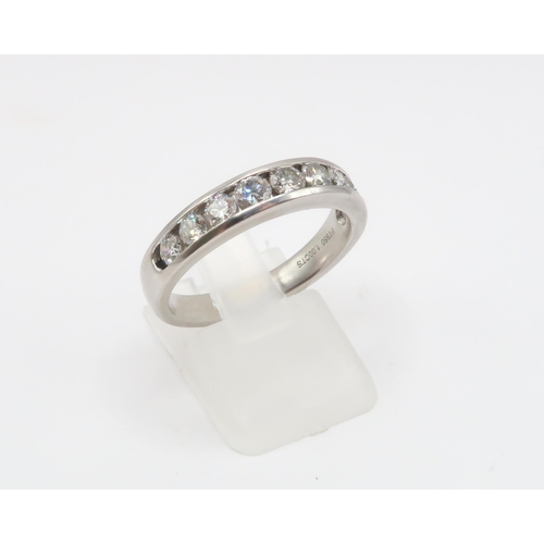 10 - A Platinum Diamond 9 Stone Diamond Eternity Ring, 1ct Total Diamond Weight. Weight: 8g Size: R 1/2 C... 