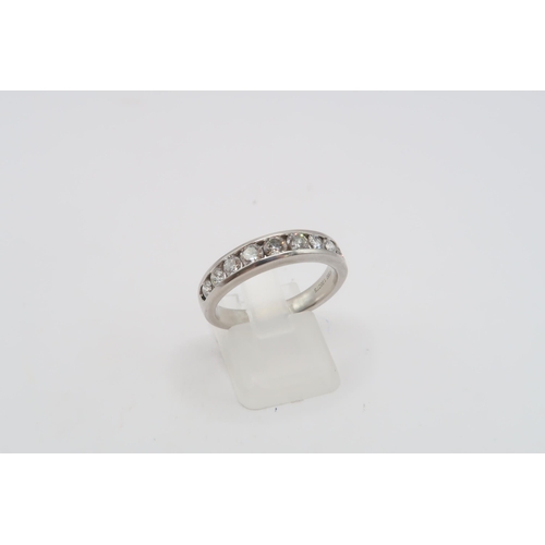 10 - A Platinum Diamond 9 Stone Diamond Eternity Ring, 1ct Total Diamond Weight. Weight: 8g Size: R 1/2 C... 