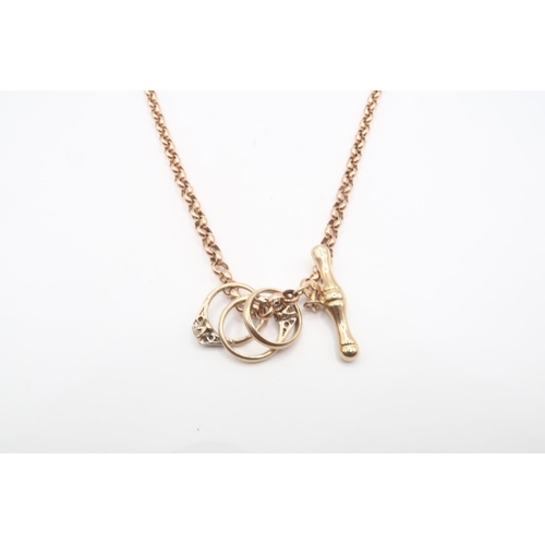 108 - A 9ct Antique Style Albert Chain and T Bar with ring charms attached.&nbsp;Weight: 9.51g Length: 46c... 