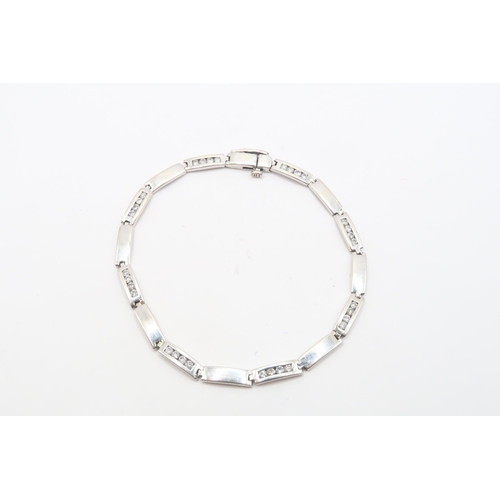 111 - A 9ct Diamond Bar Link Bracelet, Composed of alternating polished and diamond-set rectangular links.... 
