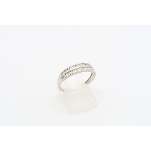 114 - A 9ct White Gold Double Row Eternity ring, featuring round and Tapered baguette cut diamonds. .33ctW... 
