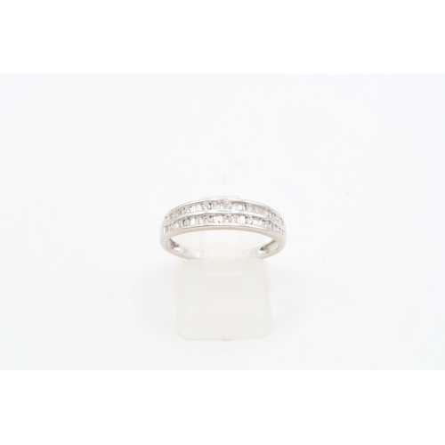 114 - A 9ct White Gold Double Row Eternity ring, featuring round and Tapered baguette cut diamonds. .33ctW... 
