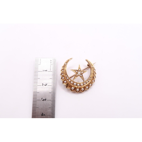 16 - A Victorian 18ct Seed Pearl & Diamond Crescent Brooch, Featuring 32 Individually set pearls with... 