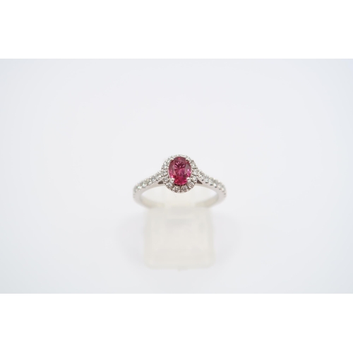 18 - A platinum ruby and diamond ring - diamonds well matched, bright and lively - head size approx 8mm x... 