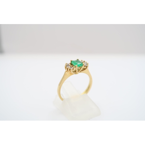 19 - An 18ct yellow gold (tested) emerald and diamond ring, emerald has natural inclusions, diamonds brig... 