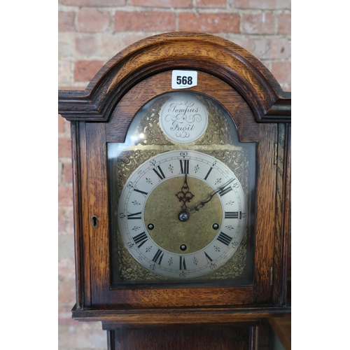 568 - An Eight Day 3 Train Grandmother Clock, Featuring a brass engraved dial marked 'Tempus Fugit'.