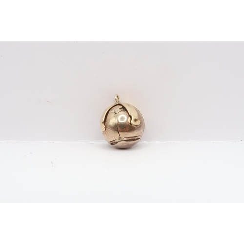 70 - A 9ct and silver masonic ball pendant. 17mm diameter. Weight 8.88 grams