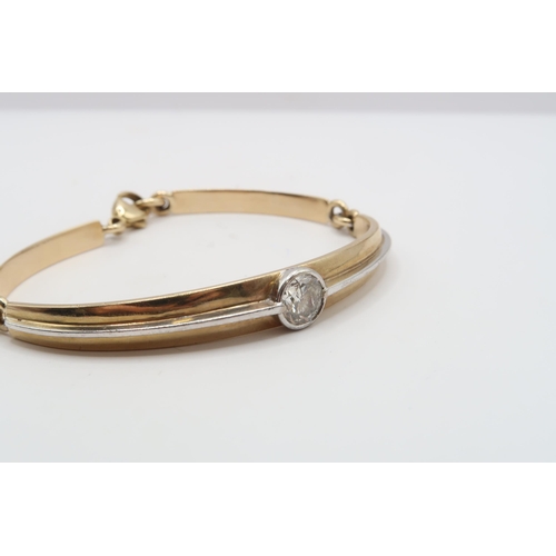 8 - A 9ct bi colour bracelet collet set with a brilliant cut diamond. Estimated 1.60cts I/J colour, SI2/... 