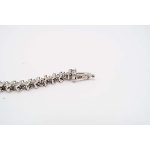 9 - A 10ct 'S' Link Design Diamond 'Tennis' Bracelet Bracelet. Featuring 48 Individual Claw Set Diamonds... 