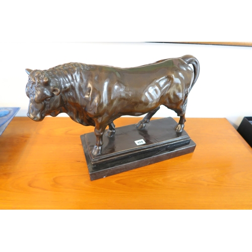 459 - A bronze statue of a bull on a marble base, signed 'Debut', good condition, 49cm wide x 34cm high in... 