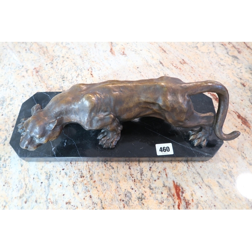 460 - A bronze statue of a crouching Jaguar on a marble base, good condition, 43cm wide x 16cm high incl b... 