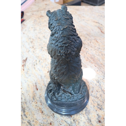 461 - A bronze statue of a Black Forest type bear on a circular marble base, 32cm high x 15cm diameter&nbs... 
