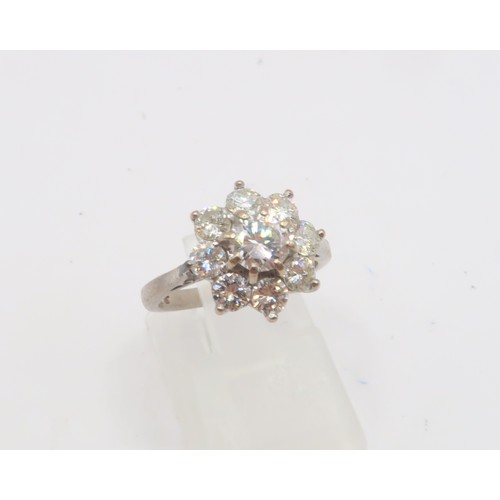 3 - An 18ct gold diamond daisy cluster ring. Estimated total diamond weight 1.30cts. Estimated G/H colou... 