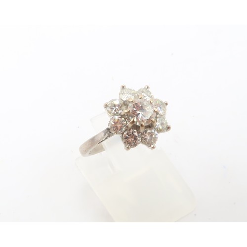 3 - An 18ct gold diamond daisy cluster ring. Estimated total diamond weight 1.30cts. Estimated G/H colou... 