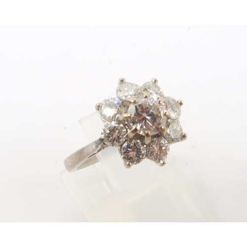 3 - An 18ct gold diamond daisy cluster ring. Estimated total diamond weight 1.30cts. Estimated G/H colou... 
