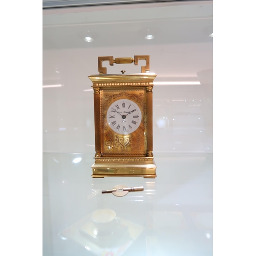 622 - A good quality carriage clock striking on a bell, with key, working in saleroom
