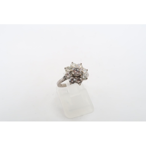 3 - An 18ct gold diamond daisy cluster ring. Estimated total diamond weight 1.30cts. Estimated G/H colou... 