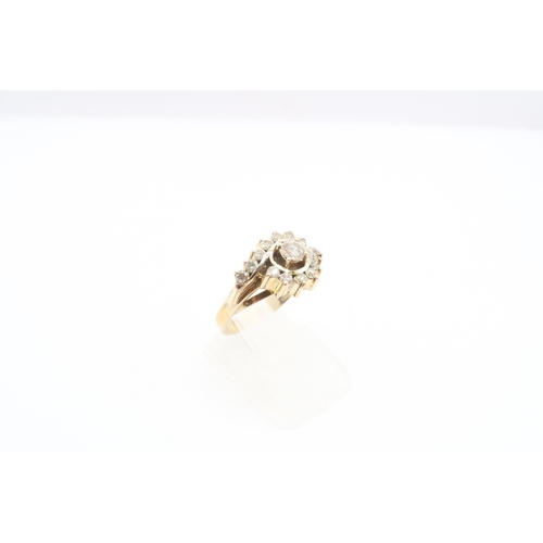 44 - A diamond crossover cluster ring. Tests gold 14ct. Size K 1/2. Weight 4.08 grams